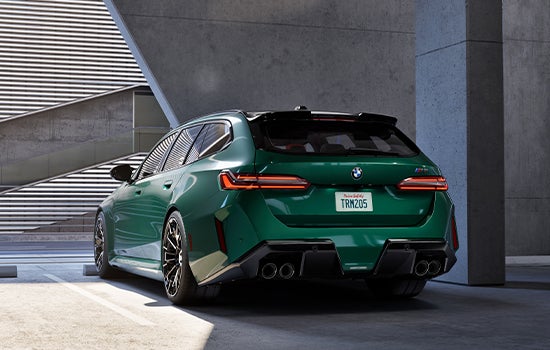 Green BMW M5 Touring parked in garage. | BMW of Allentown in Allentown PA