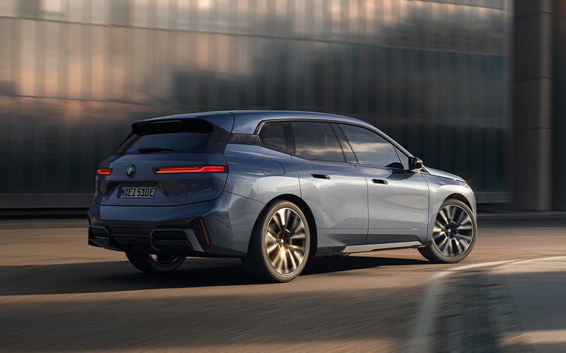 The BMW iX driving with the front wheel turned. | BMW of Allentown in Allentown PA